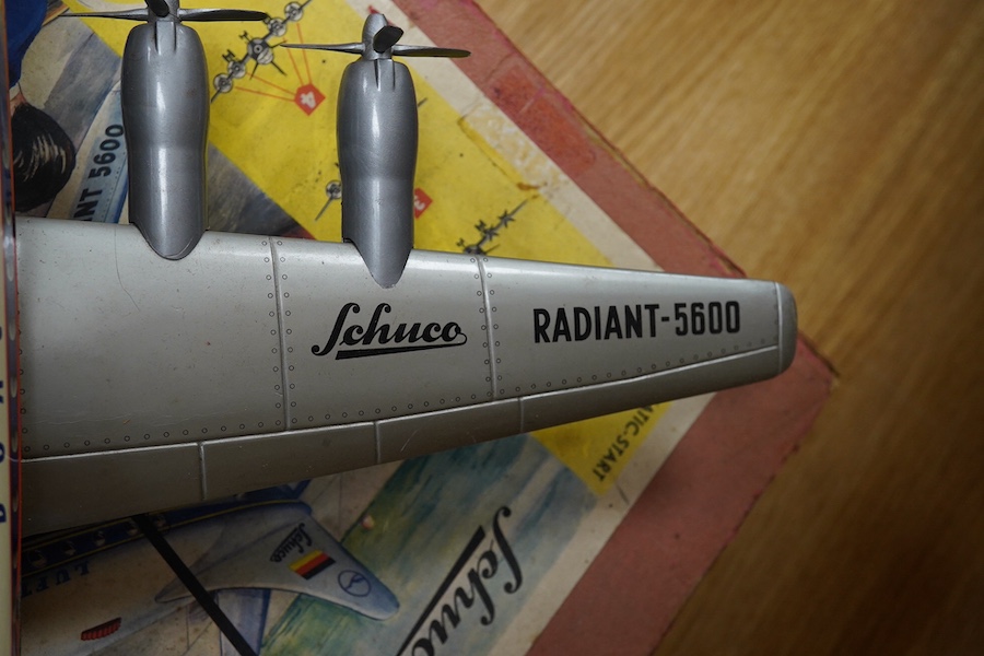 A boxed Schuco Elektro Radiant 5600 battery operated tinplate BOAC passenger aircraft, with instruction leaflet and steering wheel. Condition - poor to good, wear and damage to box and some tape repairs, aircraft general